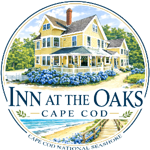 Illustration of a yellow Victorian inn surrounded by blue hydrangeas and greenery, labeled "Inn at the Oaks, Cape Cod."